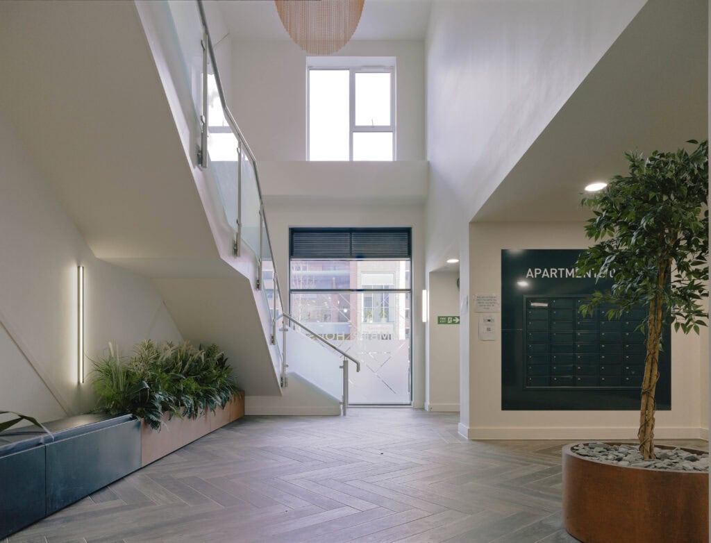 Amber house lobby with wall recessed mailboxes